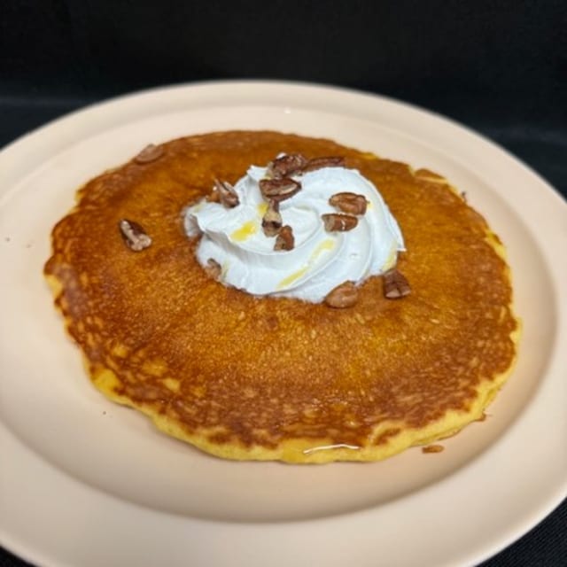 Two Pecan Hot Cakes with Whipped Cream.